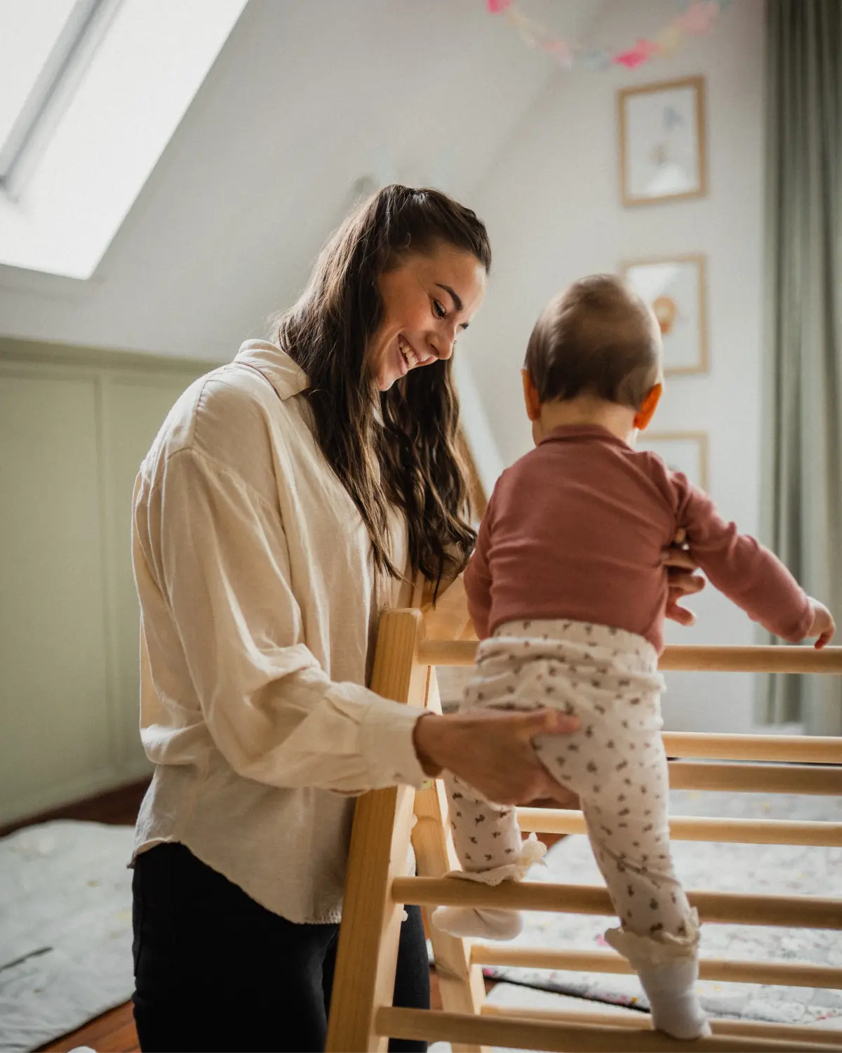 Flanny with Baby on climbing triangle 