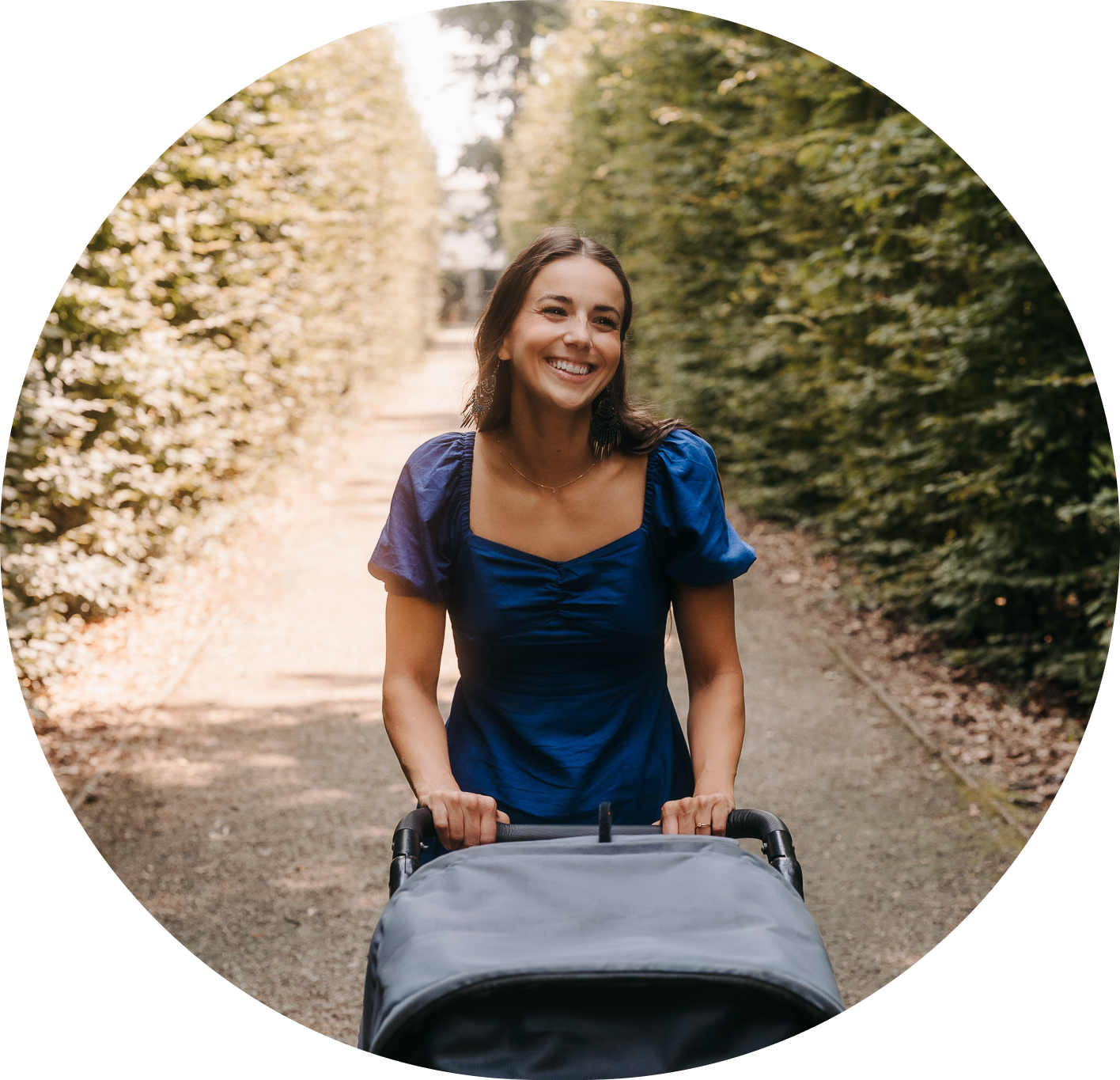 Girl sitting on ground and smiling
